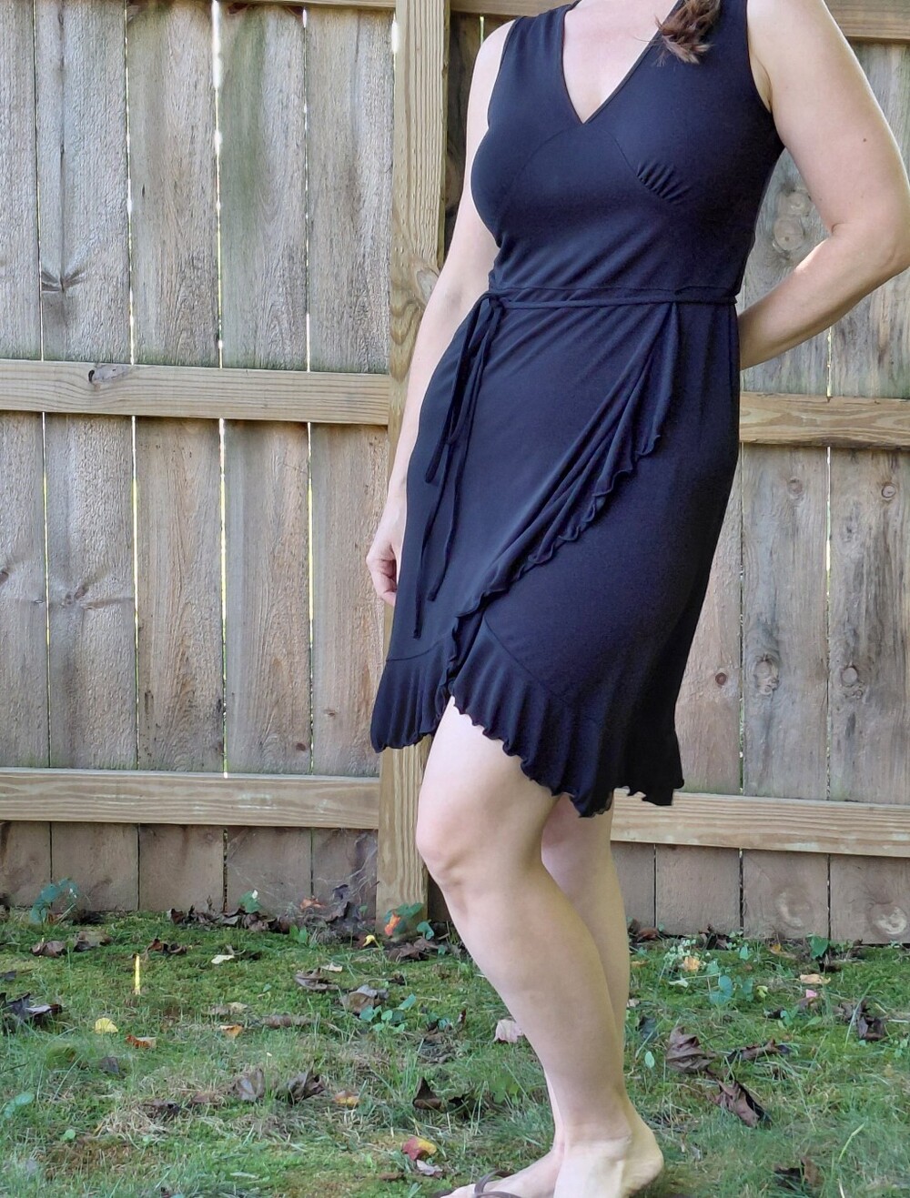 Black Sleeveless V-Neck Mock Wrap Dress with High-Low Ruffle Hem